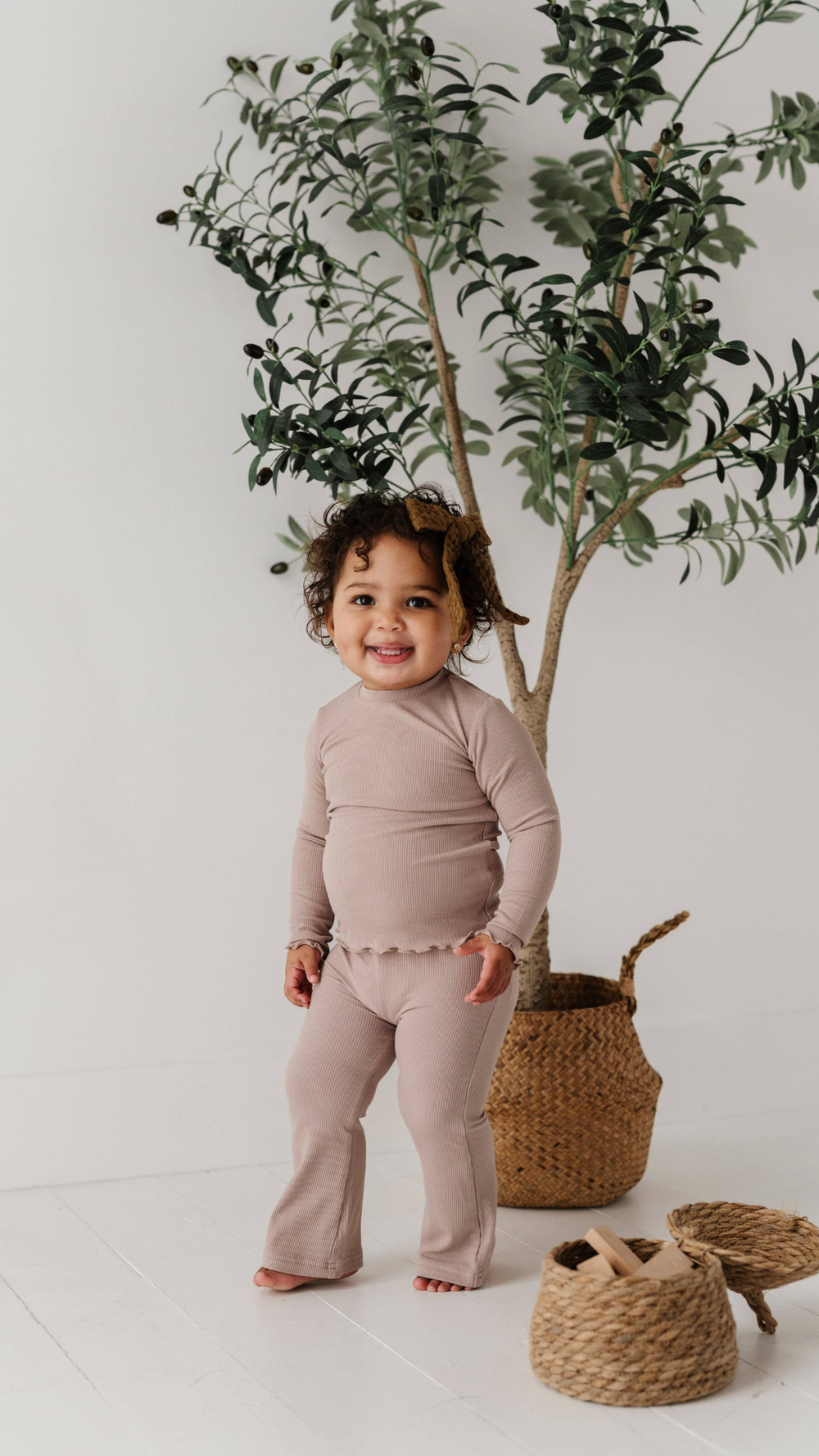 Toddler in lilac lettuce hem tee paired with bamboo flare pants, a stylish and comfortable outfit for fall layering