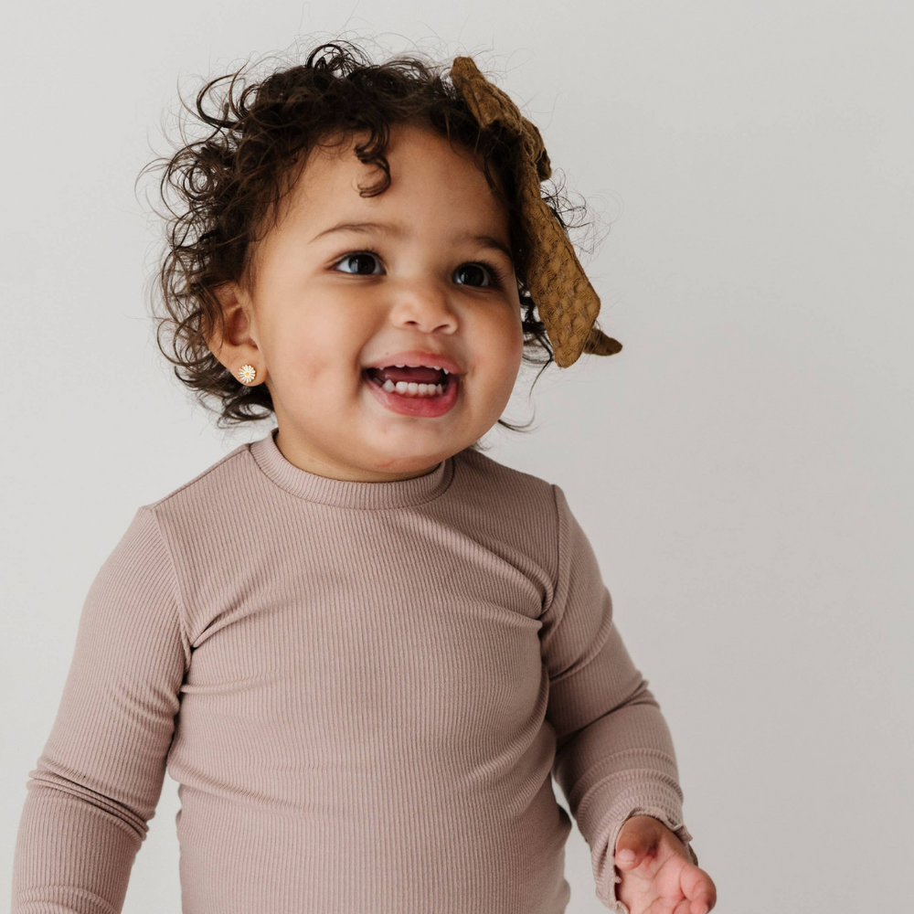 Toddler wearing lilac bamboo long sleeve tee with lettuce hem in studio, showcasing soft fabric and playful design for everyday wear.