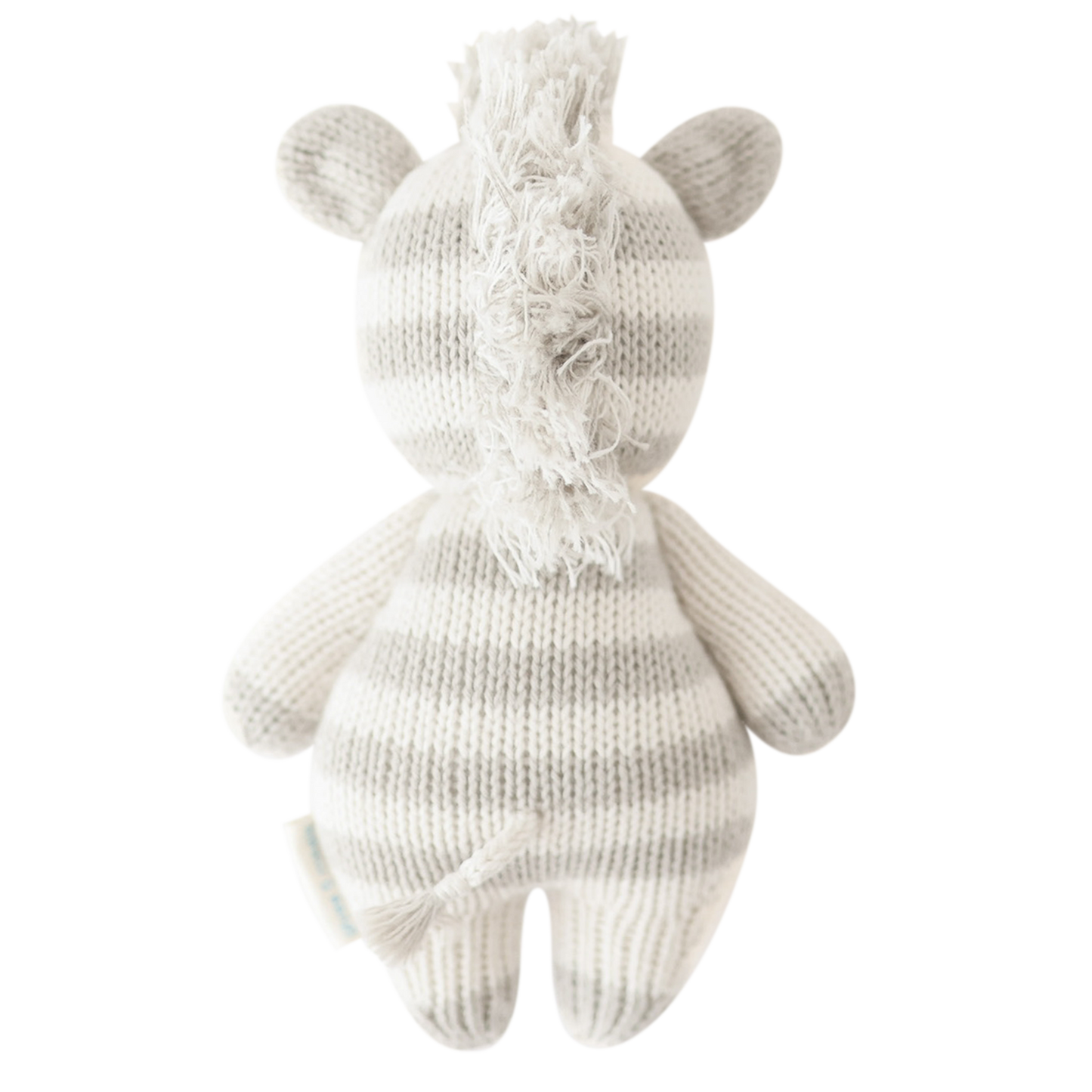 Back view flatlay of Cuddle + Kind Baby Zebra showing tail and hand-knit texture