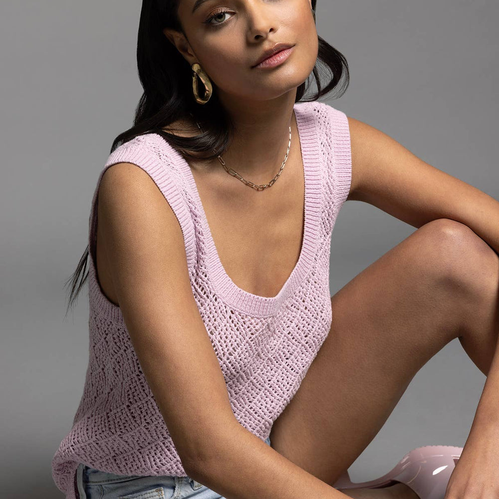 
                      
                        Model sitting in studio wearing Bailey Square Neck Knit Top in lilac paired with shorts, showing relaxed styling
                      
                    