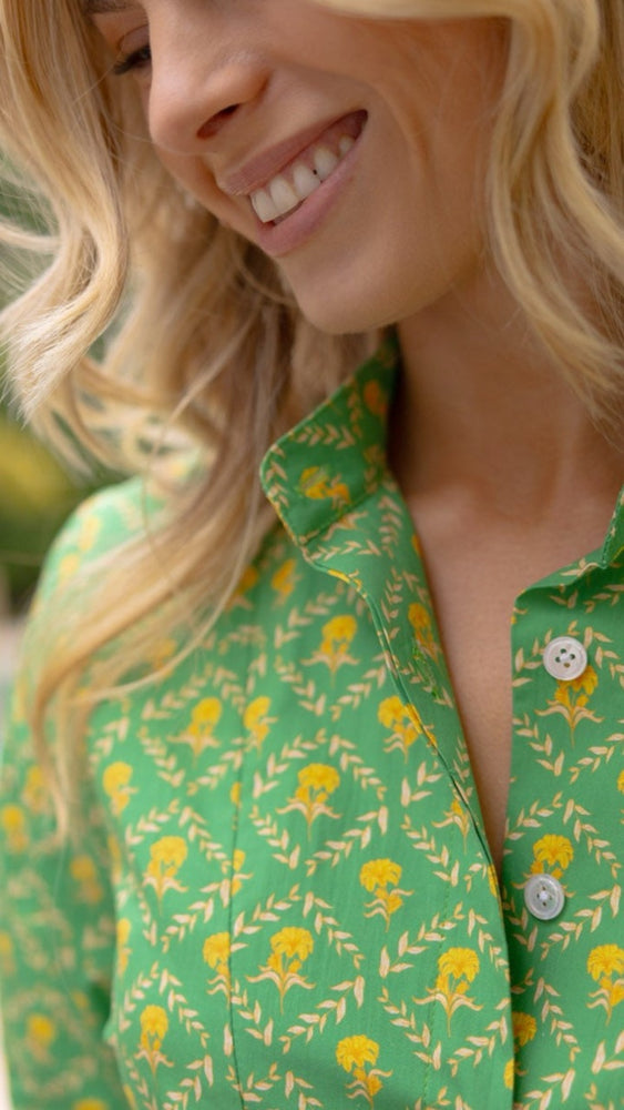 
                      
                        Close-up of the Beaux Dress in tropical trellis print featuring the structured Mandarin collar and breathable cotton fabric with sun protection.
                      
                    