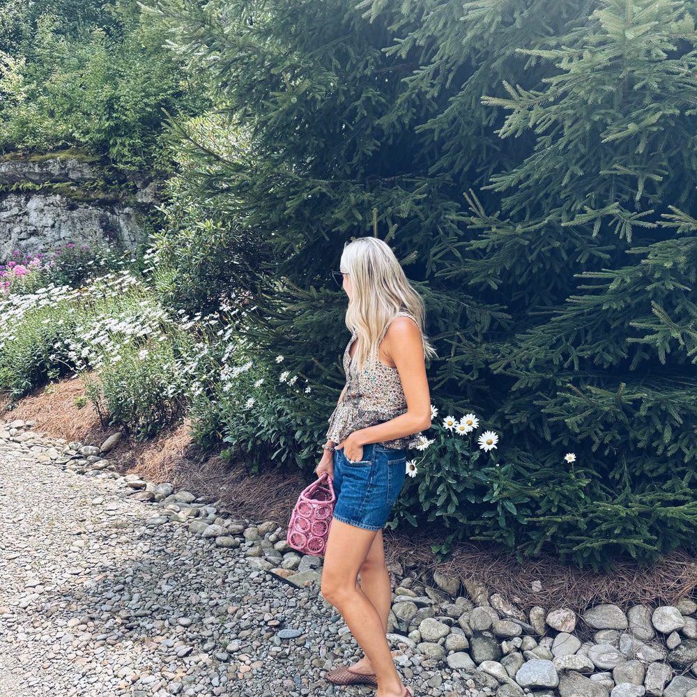 
                      
                        Beck Peplum Top styled with denim for an effortless, chic outfit.
                      
                    