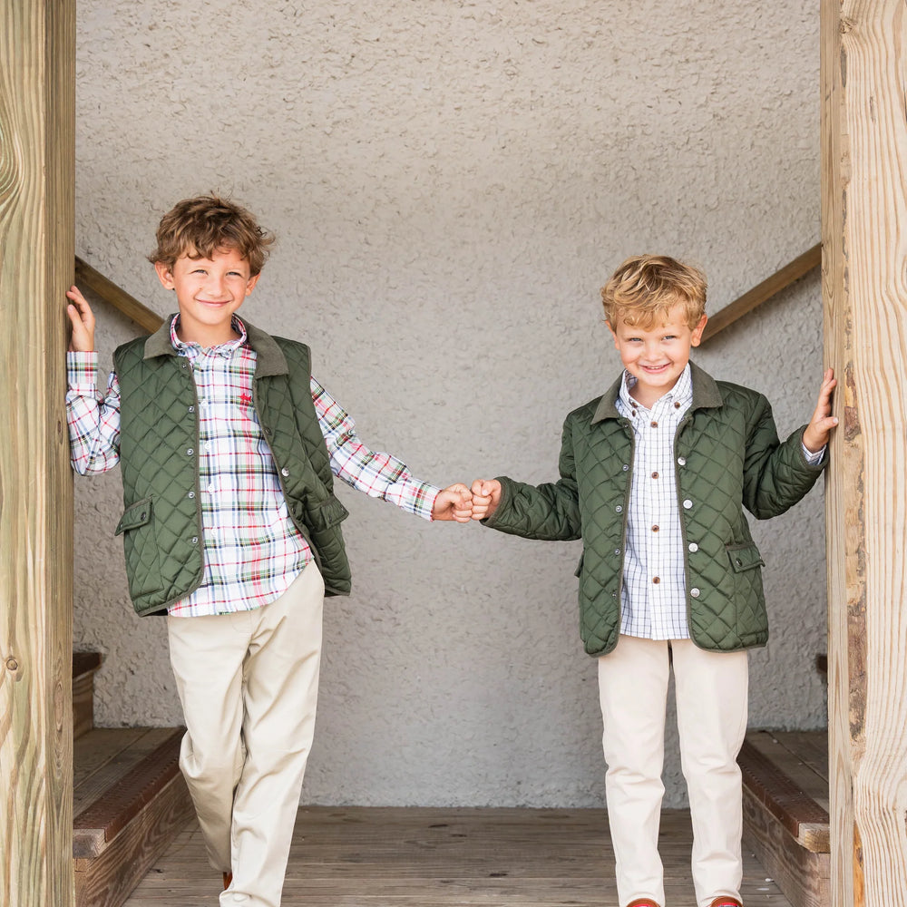 
                      
                        Two boys holding hands in doorway, one wearing Boys Derby Field Jacket with performance pants, the other in Saltwater Boys best sellers, highlighting coordinated fall styles for kids.
                      
                    