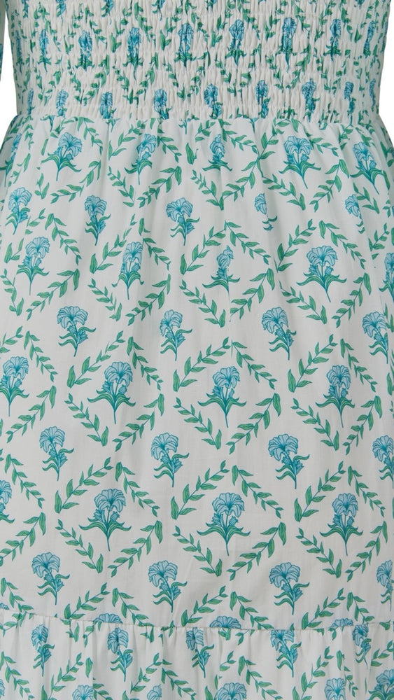 
                      
                        Close-up of the trellis print on the Bridgette Dress, highlighting the fabric texture and vibrant blue-and-white pattern.
                      
                    