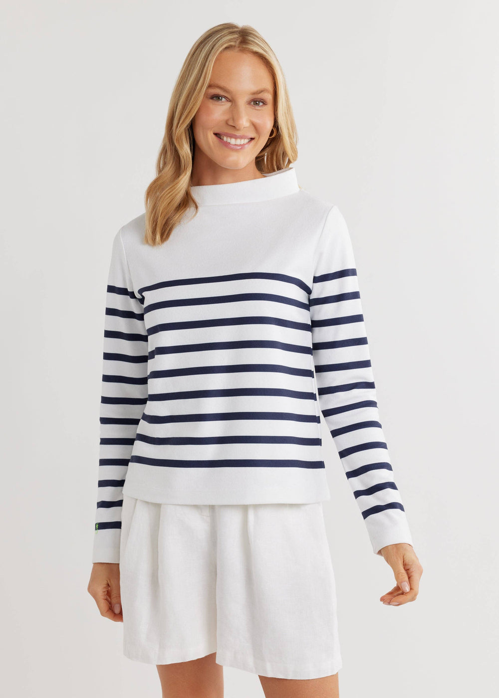 Model wearing the Brighton Boatneck by Dudley Stephens untucked with navy shorts, showcasing the laid-back yet polished silhouette of this breathable terry fleece top.
