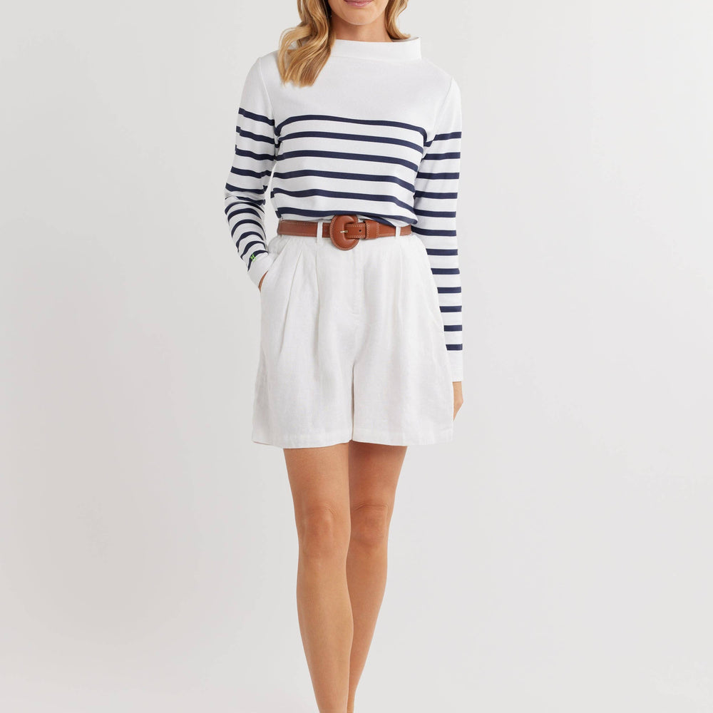 
                      
                        Brighton Boatneck in white and navy by Dudley Stephens, styled tucked into shorts for a clean, coastal look—perfect for summer days and casual outings.
                      
                    