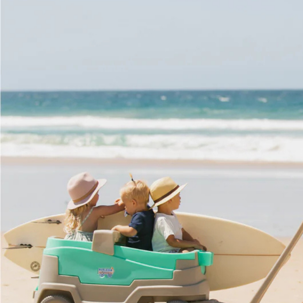 Side view of the Burleigh Wagon Kids Stroller & Beach Wagon with attached cooler, perfect for beach outings and family adventures.