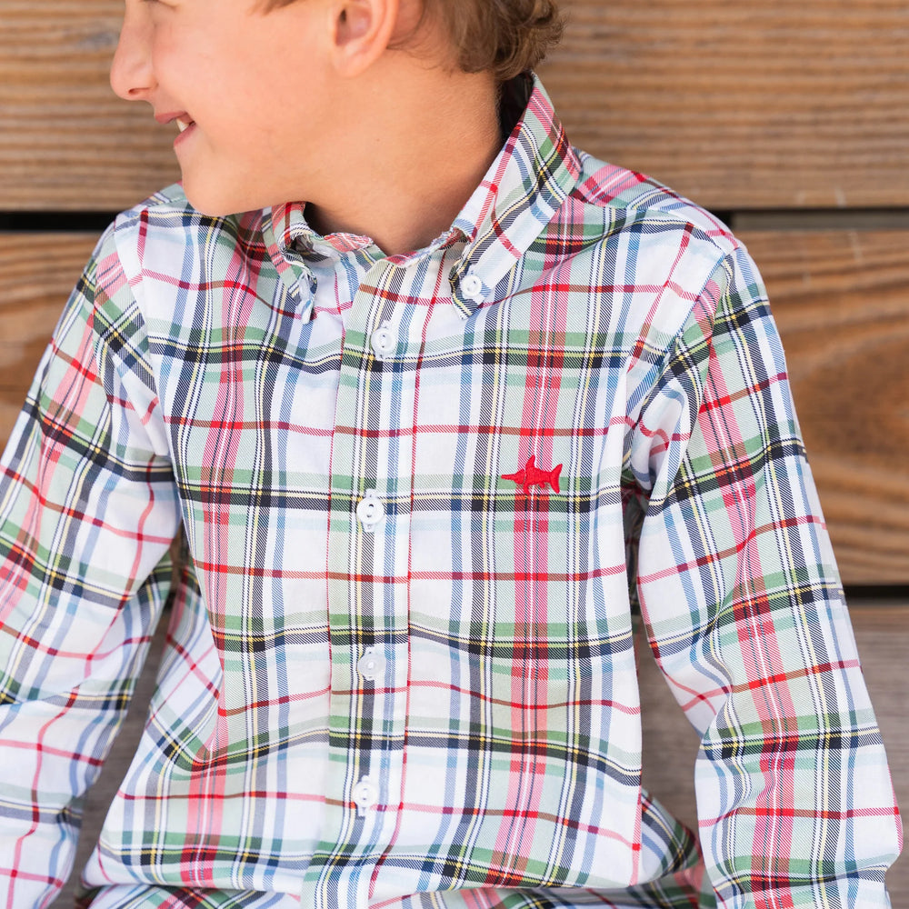Young boy wearing Carter Oxford Shirt in creme plaid, showcasing versatile style and comfortable fit for everyday wear.