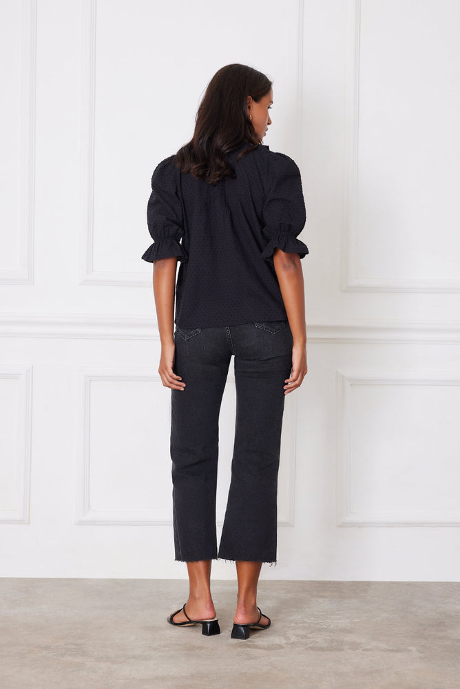 
                      
                        Back view of the Chloe Shirt in white clip dot cotton, showing the flowy fit and timeless, romantic style.
                      
                    