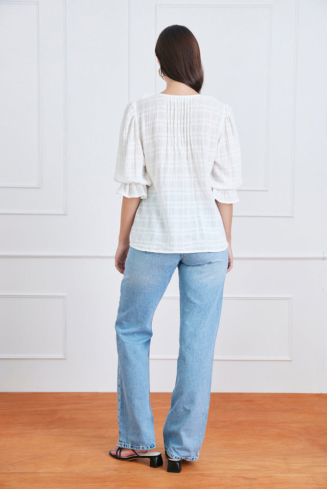 
                      
                        Back view of the Chloe Shirt in plaid cotton, showing the roomy fit and back detail of this feminine blouse.
                      
                    