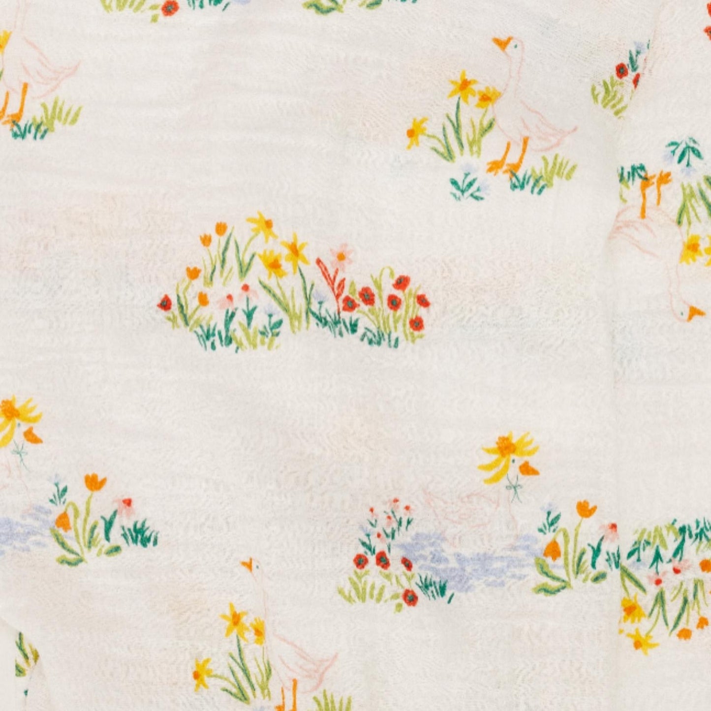 Close-up of Garden Goose baby swaddle fabric featuring soft colors and playful goose pattern