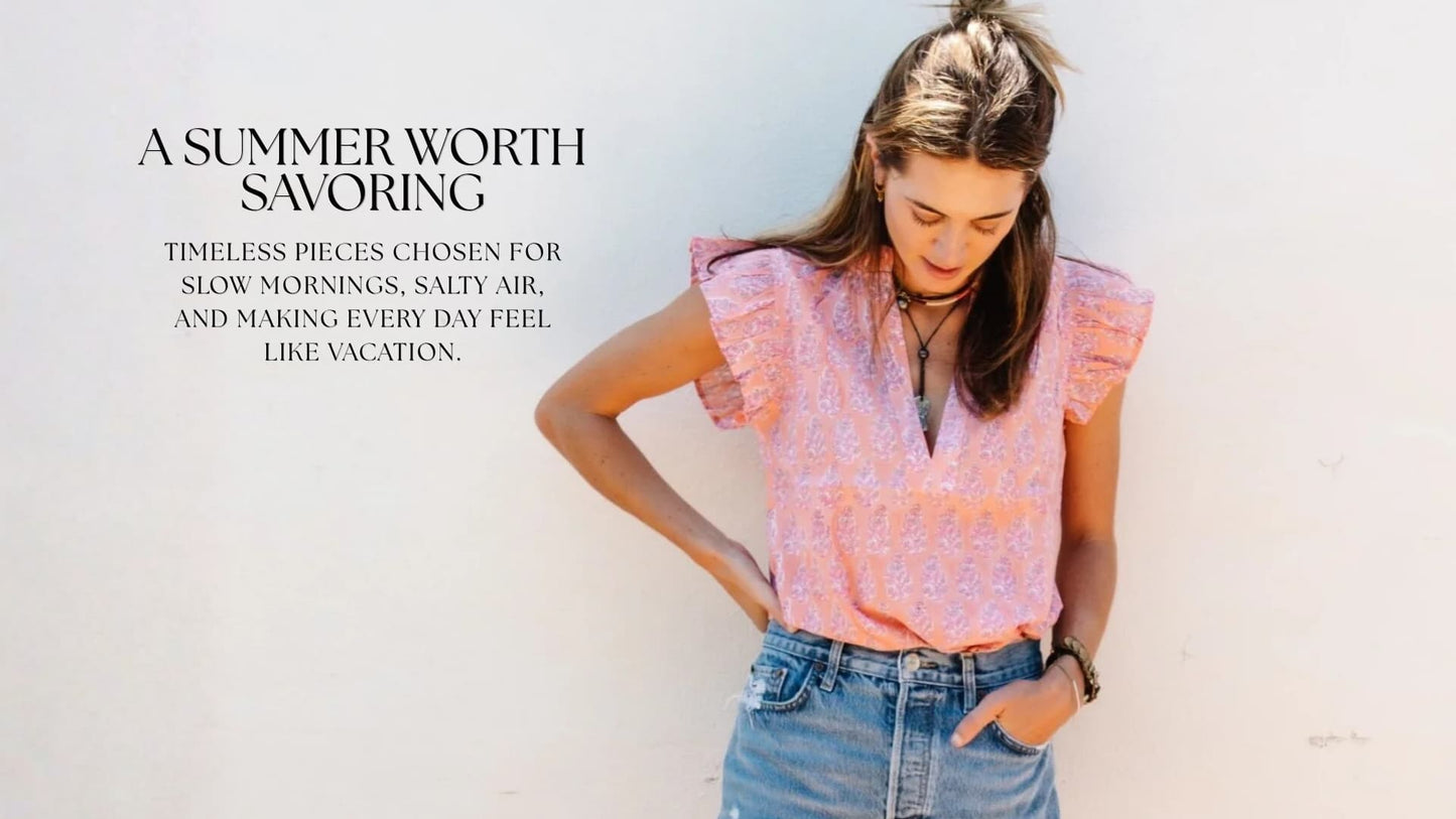 Woman in timeless summer clothing inspired by the Connecticut shoreline, featuring effortless coastal style from Grace & Haven, a women's boutique in Essex, CT.