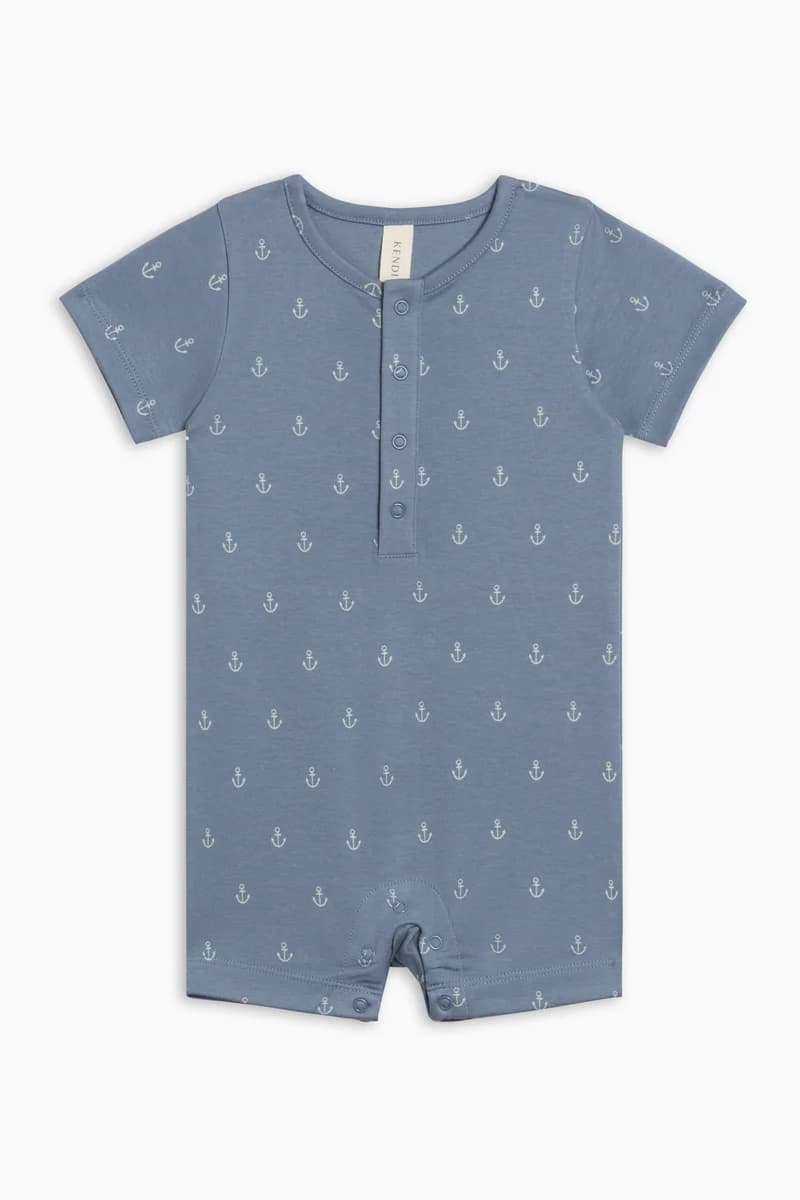 Flat lay of Colored Organics Mason Romper Anchor — lapped shoulders, anchor print, snap placket