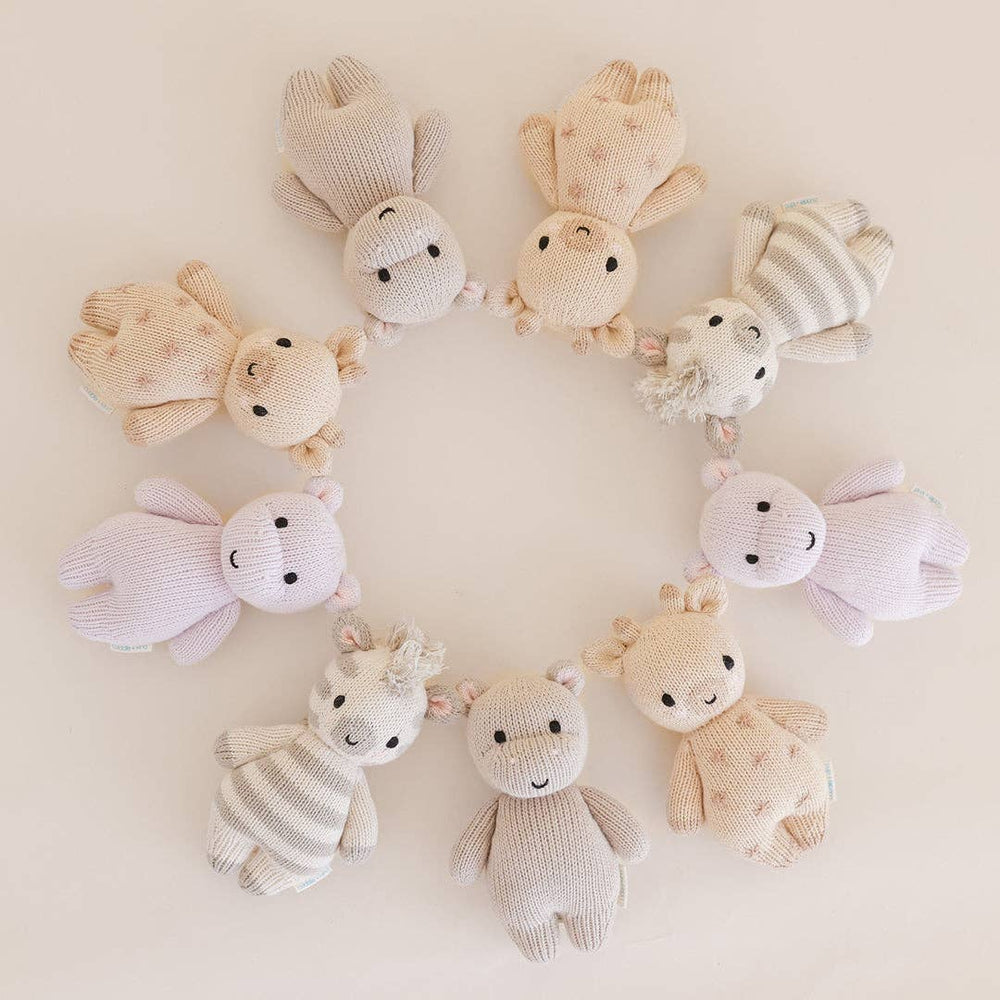
                      
                        Cuddle + Kind baby animal dolls arranged in a playful circle, including zebra, bunny, and lamb – ethical nursery toys
                      
                    