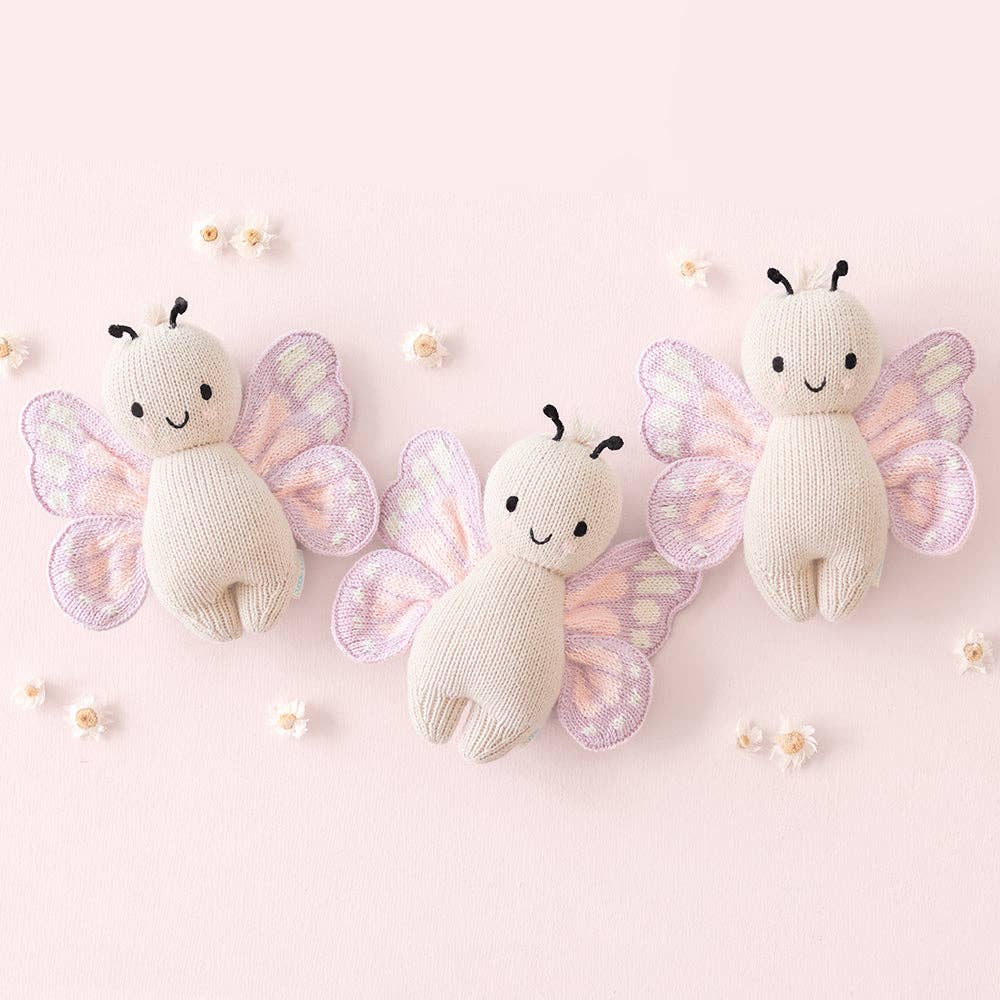 
                      
                        Three Cuddle + Kind Baby Butterfly dolls laid side by side, emphasizing heirloom quality and consistent handmade details
                      
                    