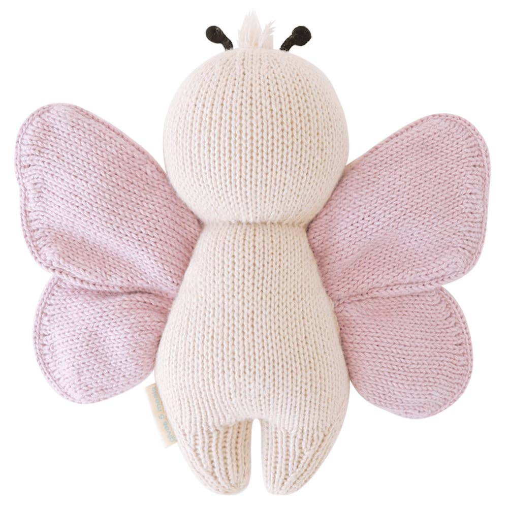 Back view of Cuddle + Kind Baby Butterfly doll highlighting soft cotton yarn wings and handmade stitching