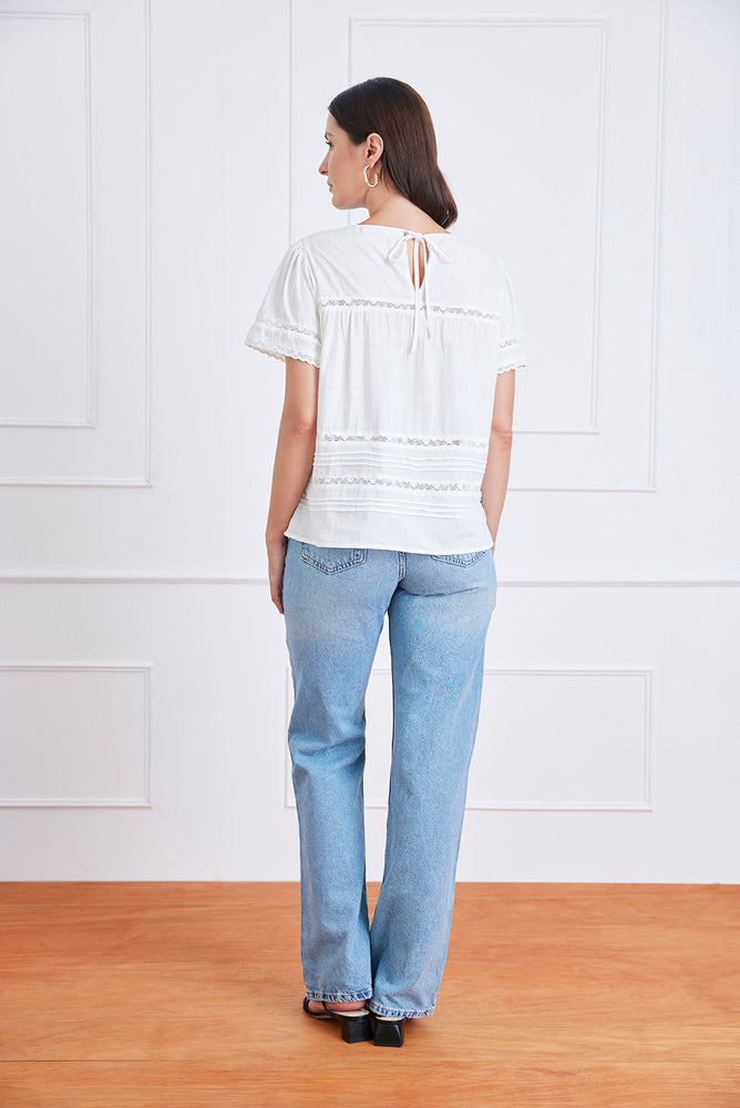 
                      
                        Back view of the Dawn Tee in Off White, showcasing the clean back silhouette and soft slub cotton texture.
                      
                    