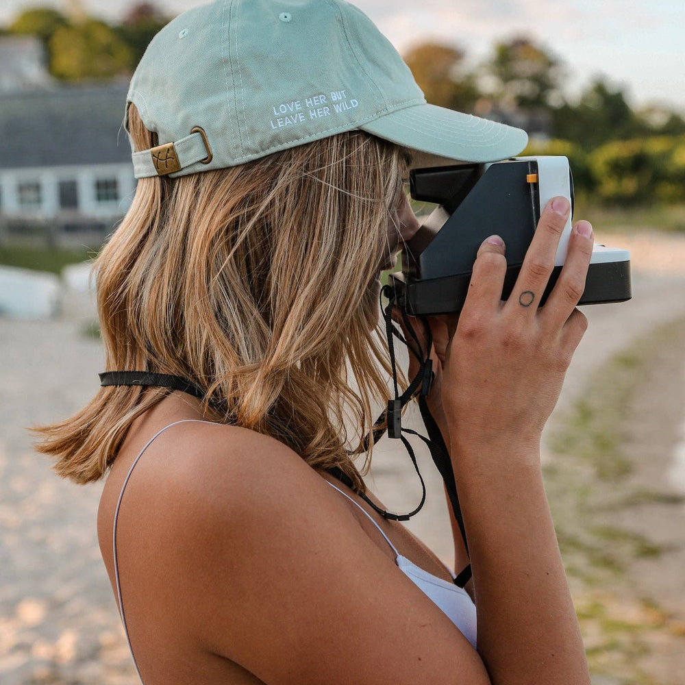 
                      
                        Mint Heart Hat by Atticus Poetry – “Love Her But Leave Her Wild” Embroidered Cotton Cap
                      
                    