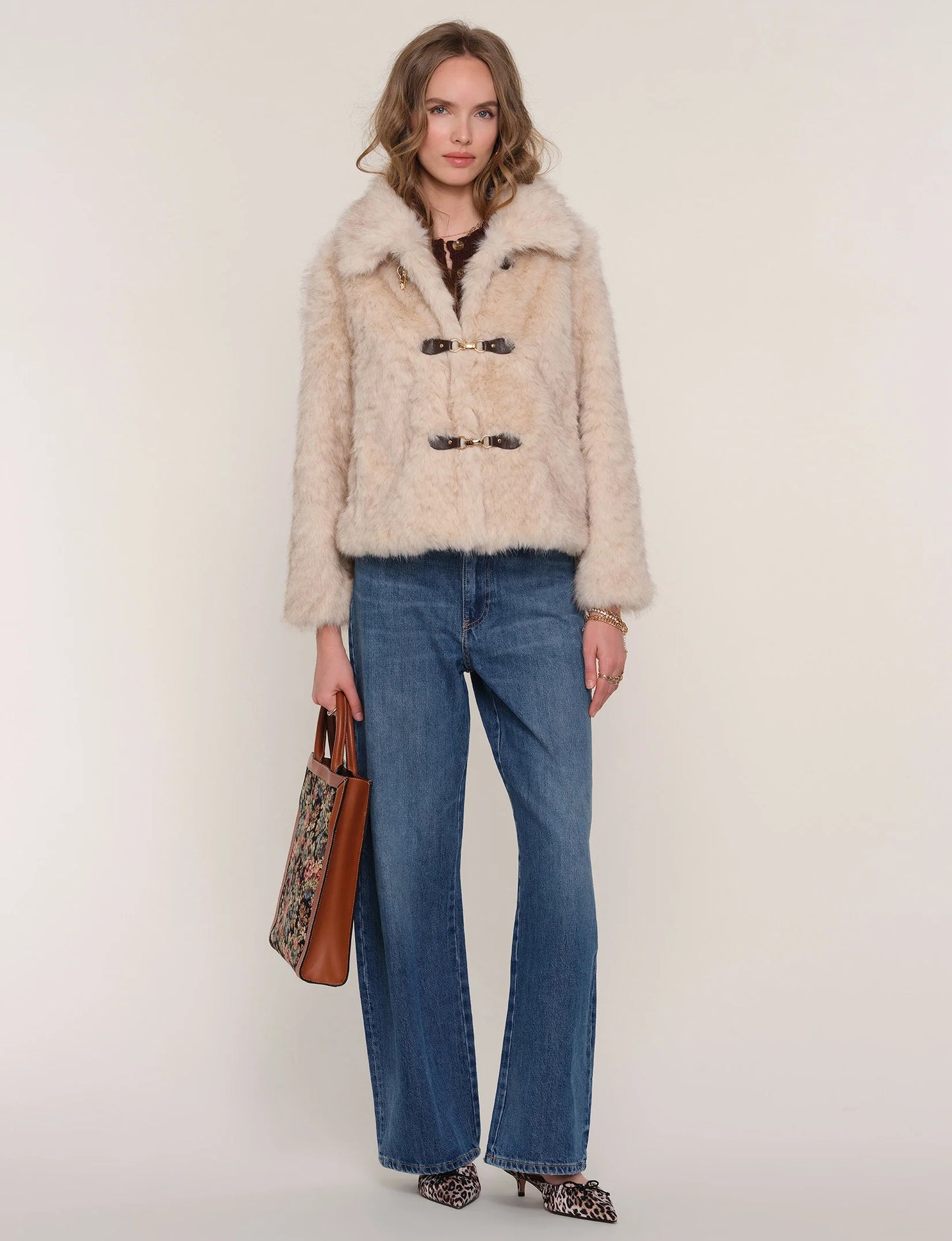 Full-length view of Elsbeth Faux Fur Jacket on model, featuring chic silhouette and versatile layering style.