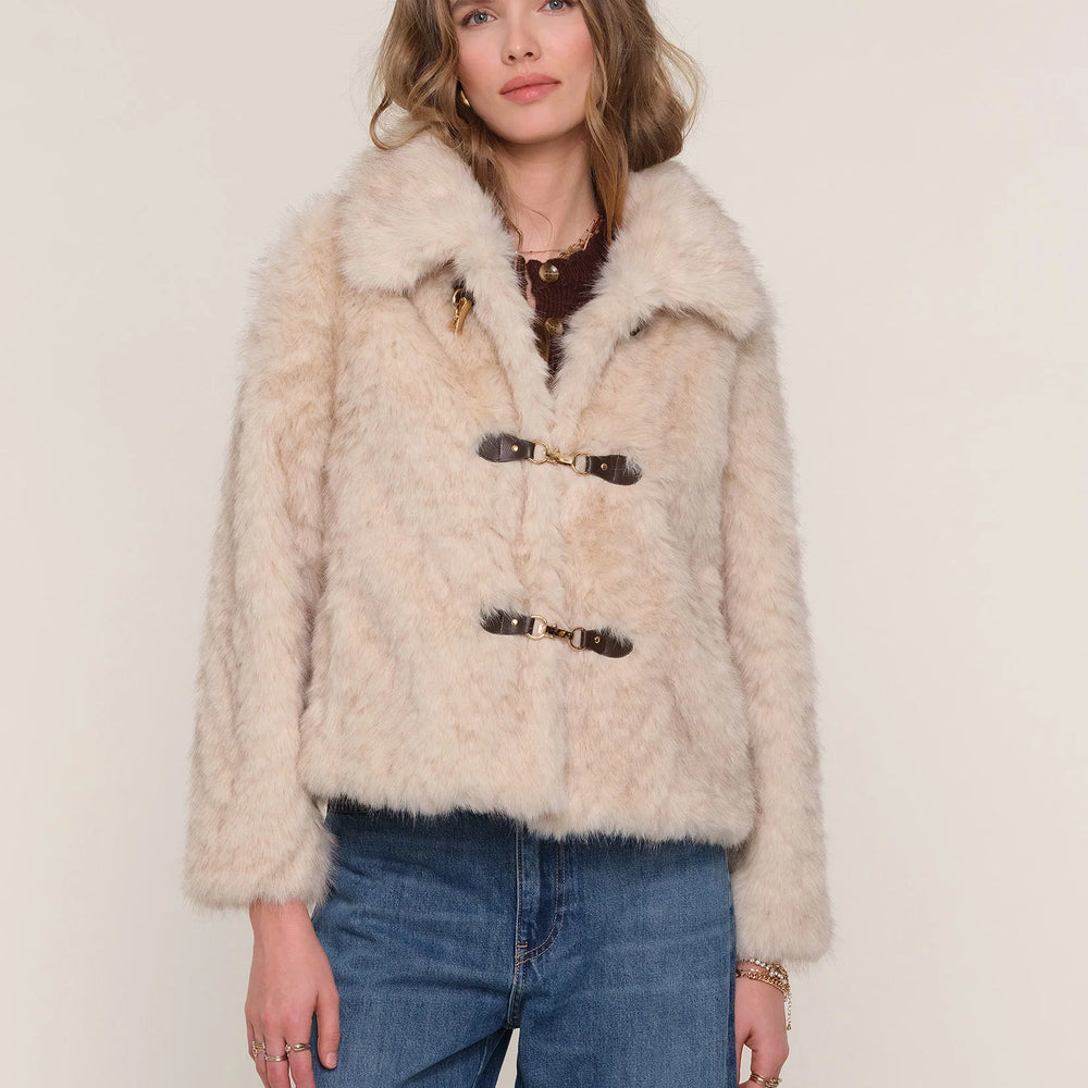 
                      
                        Mid-distance view of Elsbeth Faux Fur Jacket on model, showcasing relaxed fit and cozy faux fur detail.
                      
                    