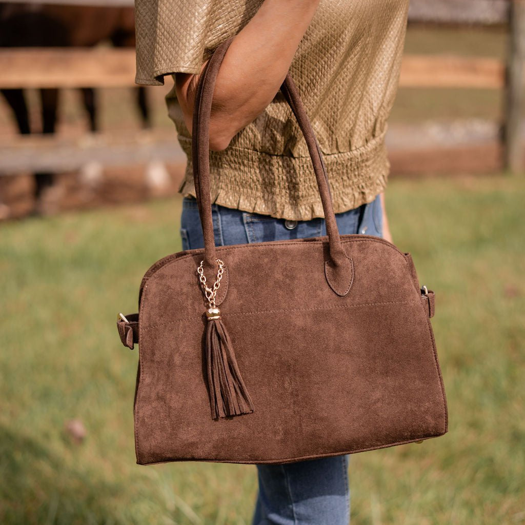Close-up of soft faux suede texture on Megan handbag.