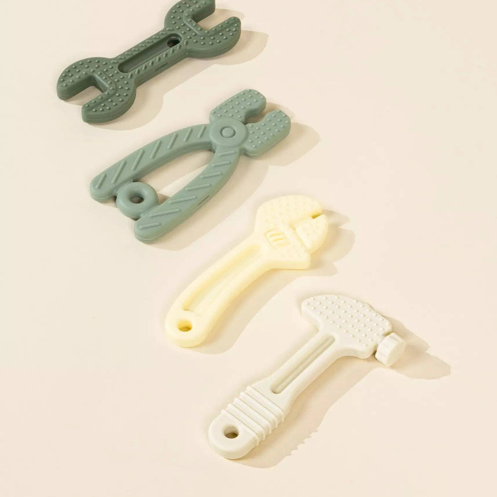 Flatlay image of Set of 4 Silicone Tools Baby Toys, soft textured shapes made of food-grade silicone, ideal for baby sensory development