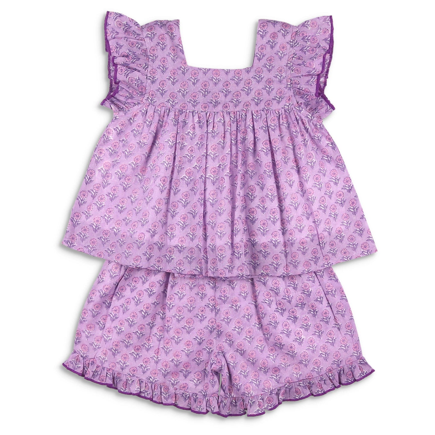 Flat lay of the Girls Ruffle Short Set in Orchid, showing the full two-piece floral cotton outfit with ruffle top and matching bloomers, hand-block printed in India.