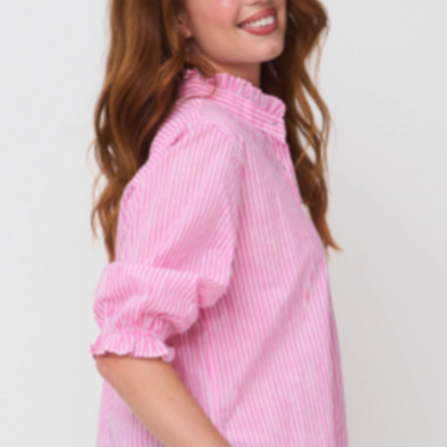 Lifestyle shot of model wearing Good Girlfriend Shirt in Dahlia pink