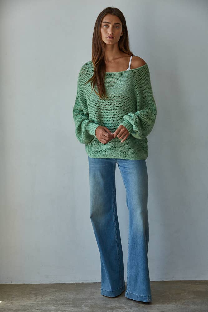 Grace & Haven best-selling crochet knit sweater in jaded green styled for transitional spring weather