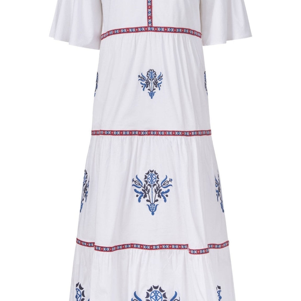 
                      
                        Flat lay of the front of the Harbor Dress showing embroidery and trim details
                      
                    