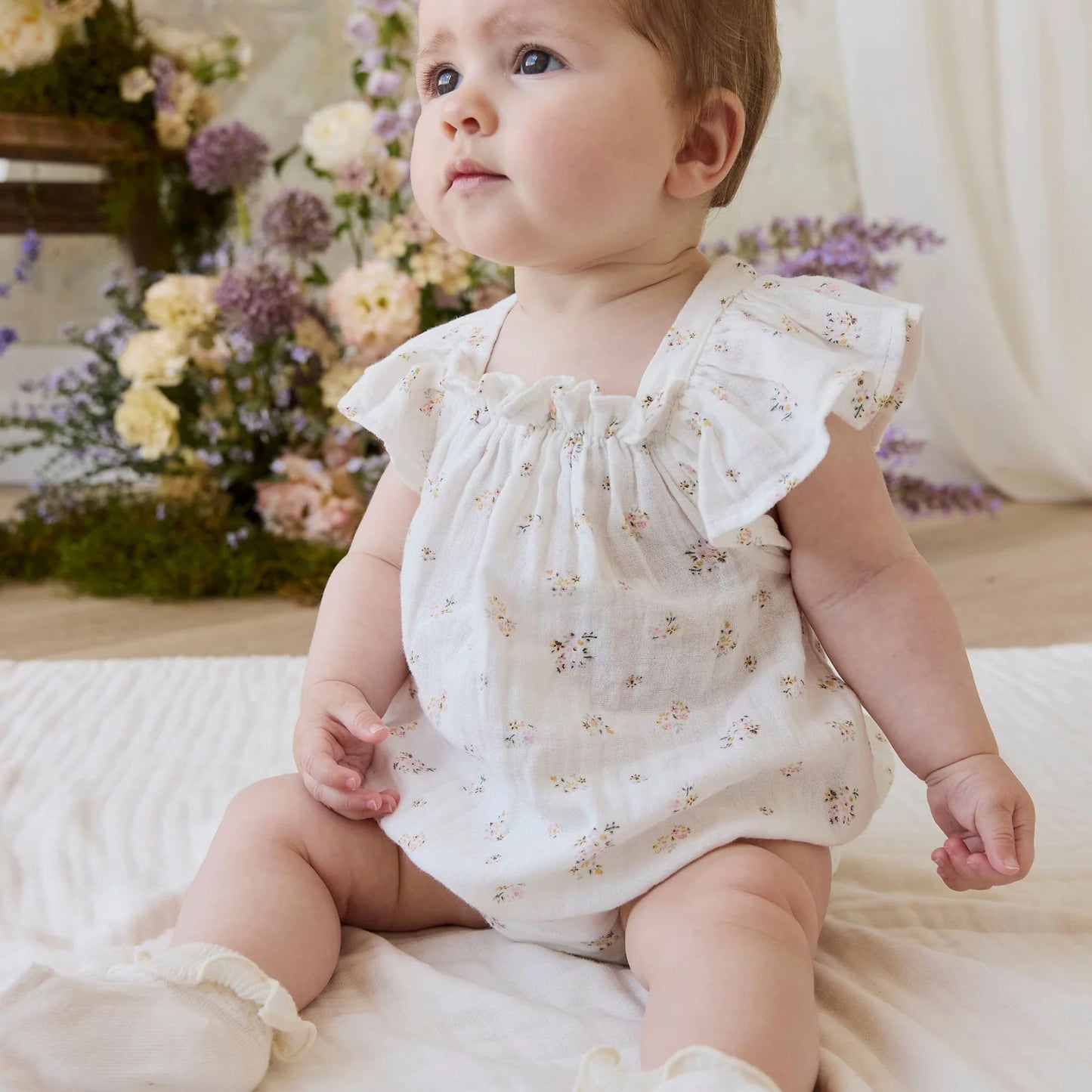 Child wearing Jamie Kay Organic Cotton Muslin Harriett Playsuit in Ayla Whisper