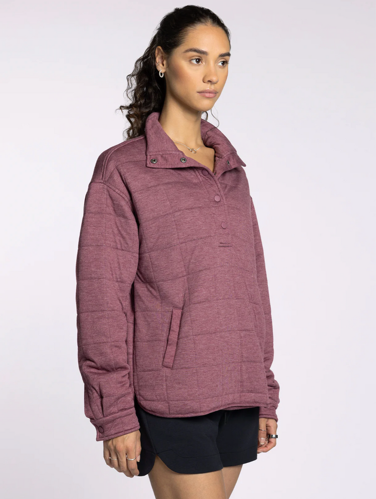 
                      
                        Back view of the Thread & Supply Indiana Pullover in rose, showing straight hemline and quilted detail.
                      
                    