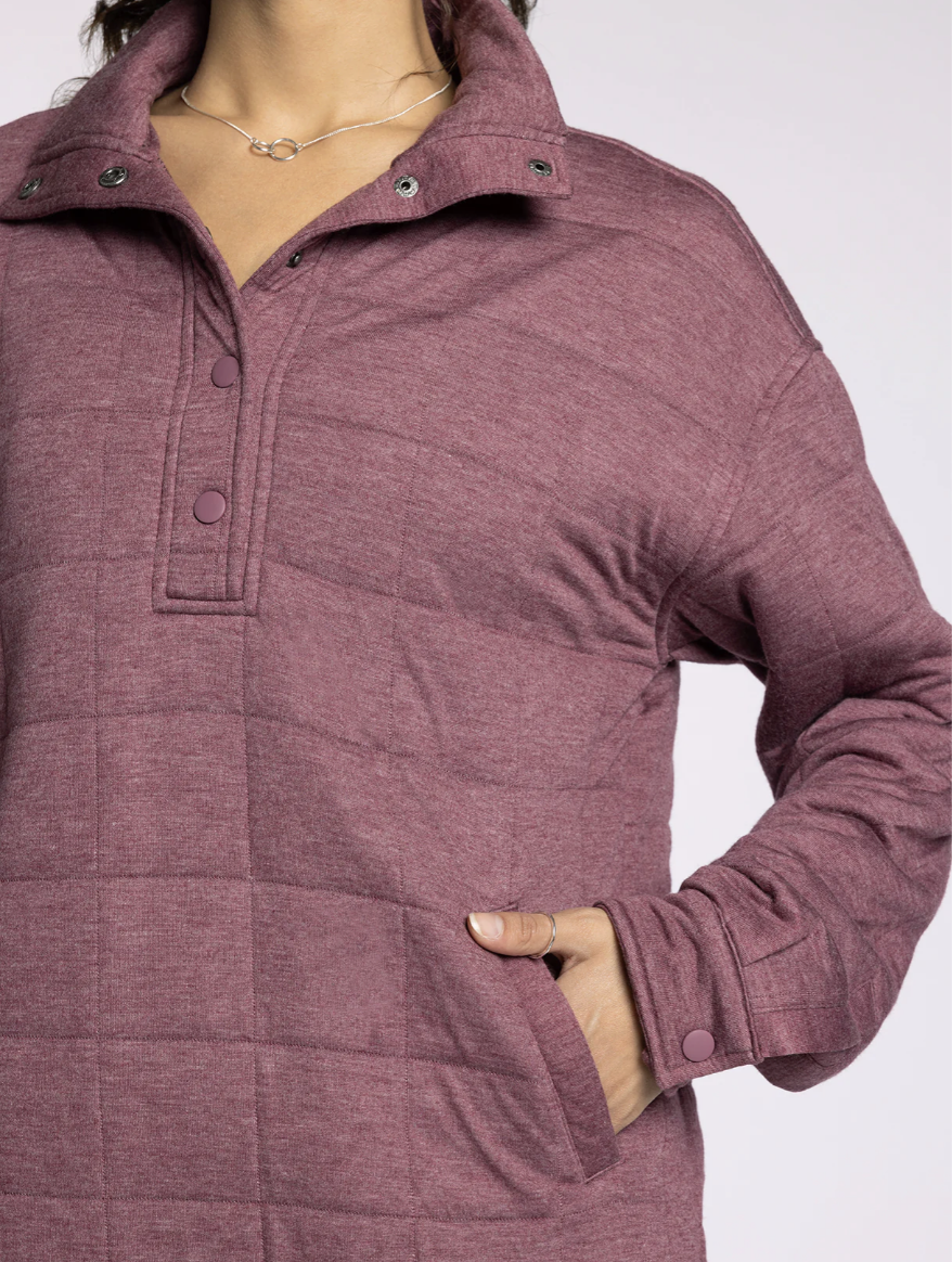 Woman wearing the Thread & Supply Indiana Pullover in rose, front view showing quarter-zip neckline and quilted texture.