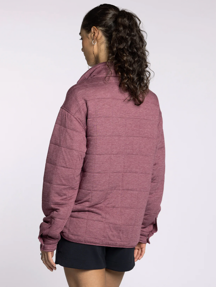 
                      
                        Side profile of model in the Indiana Pullover in rose, highlighting relaxed fit and hip-length cut.
                      
                    