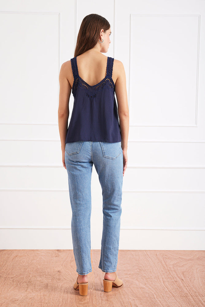 
                      
                        Back studio view of the Iris camisole, showcasing the openwork embroidery and relaxed drape.
                      
                    