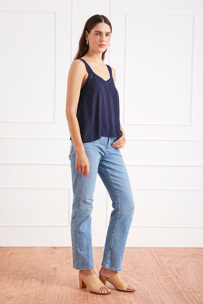 
                      
                        Right side studio view of the Iris camisole styled with denim, highlighting the bra-friendly straps and fit.
                      
                    