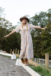 Woman wearing Ivy Coast Maren seashell print UPF 50+ shirt dress, front view, mid-length