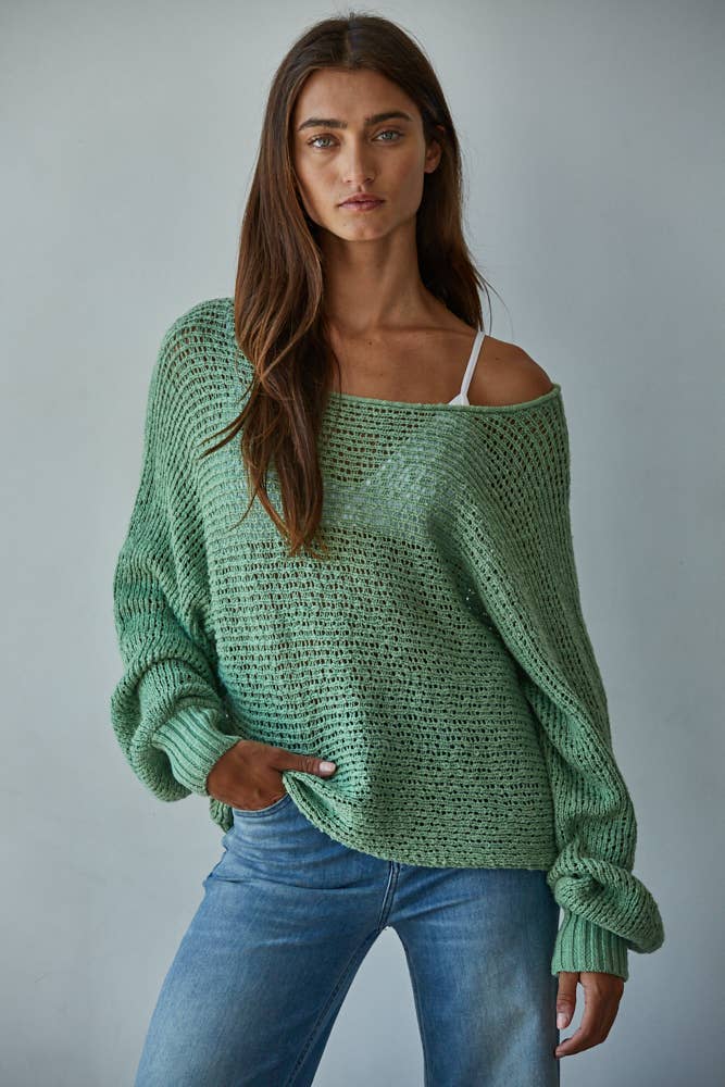 Woman wearing By Together jaded green crochet knit sweater styled for everyday spring outfit