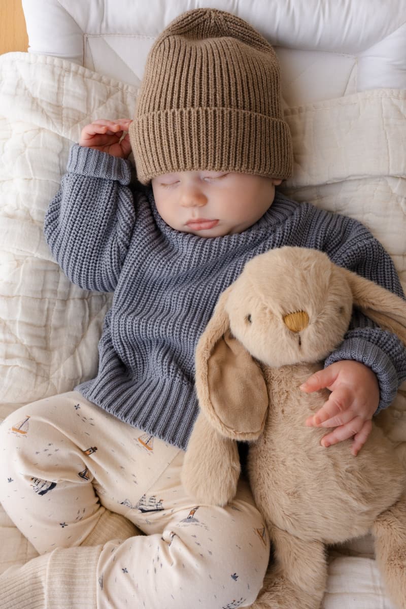 Baby snuggled up in our Jamie Kay Sailing Day organic cotton leggings, nautical print available at Grace & Haven
