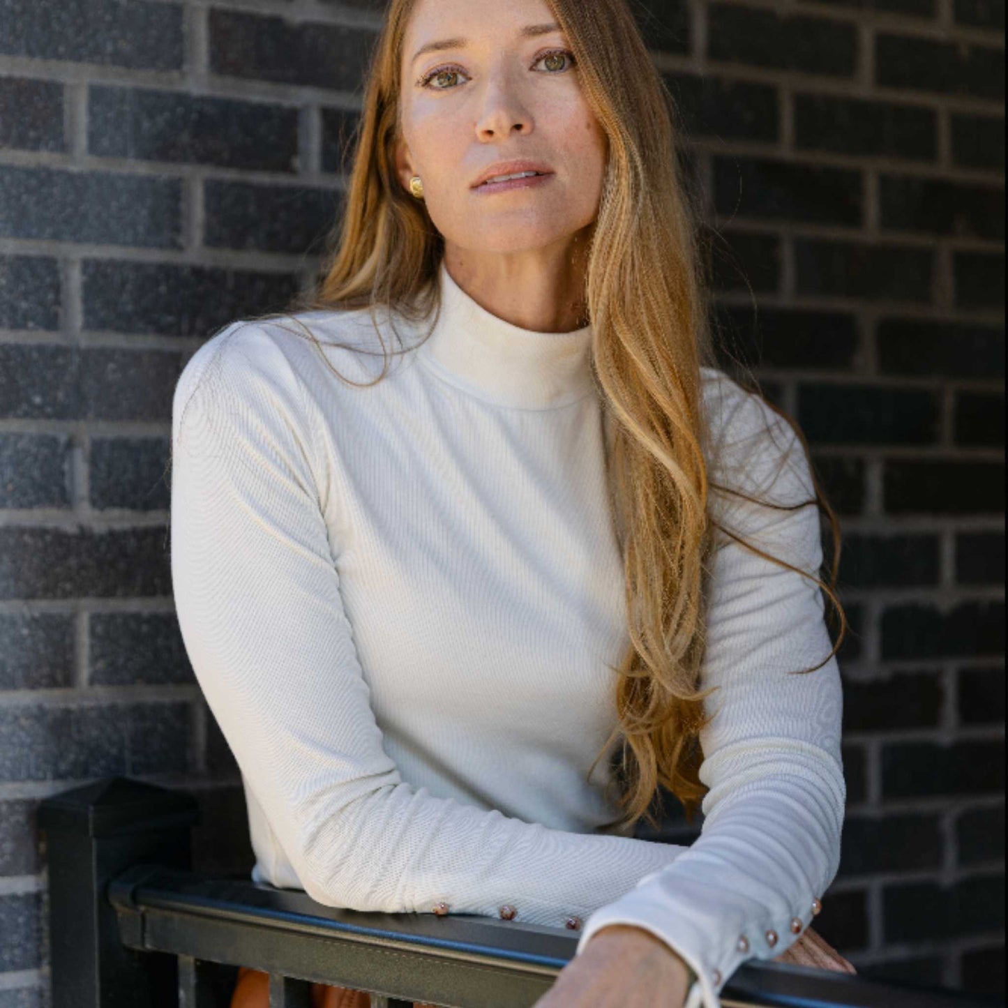 Side-angle lifestyle image showing long sleeves and fit