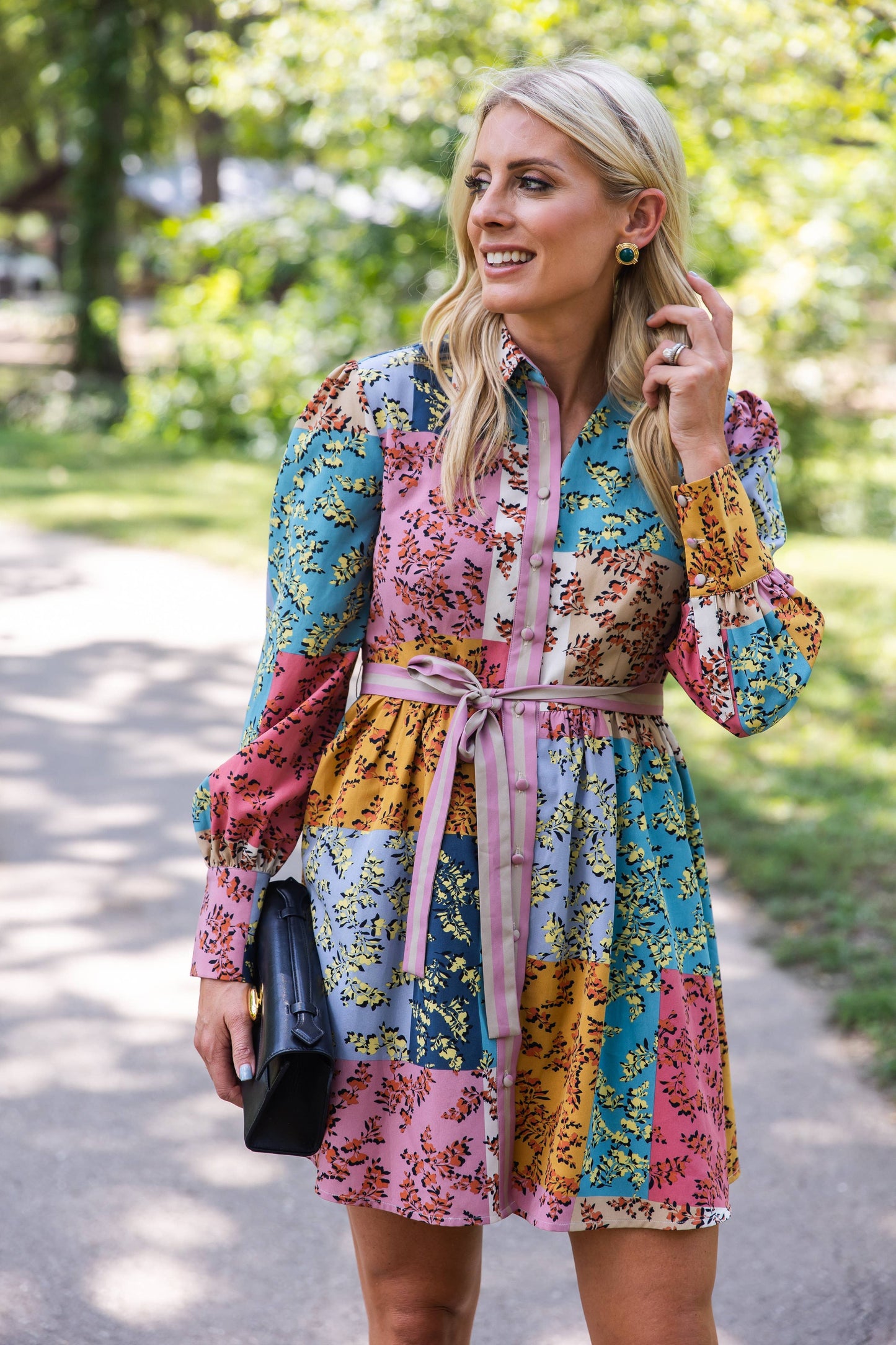 Close-up of The Jules Dress showing the bold cuff detail and colorful patchwork floral fabric.