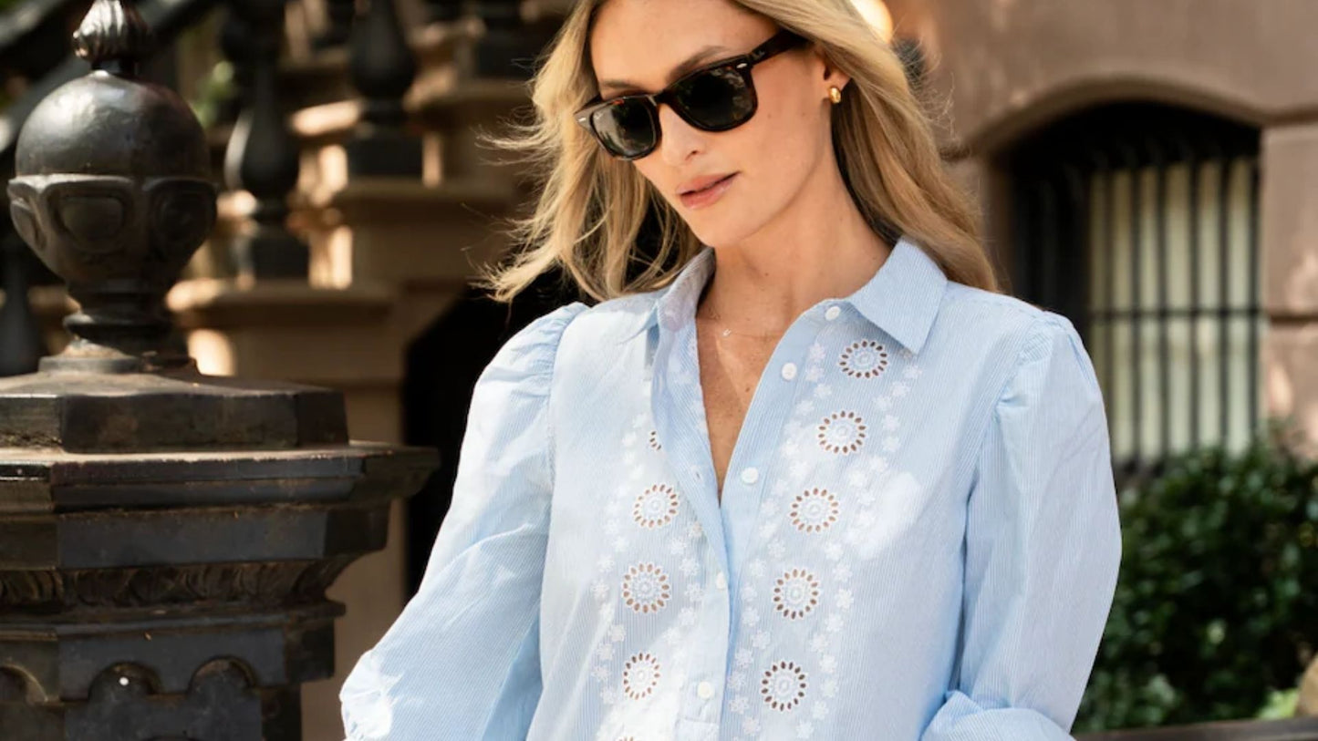 Julia McGuire wearing a Sail to Sable short-sleeve blouse with scalloped detail from the spring collection at Grace & Haven.