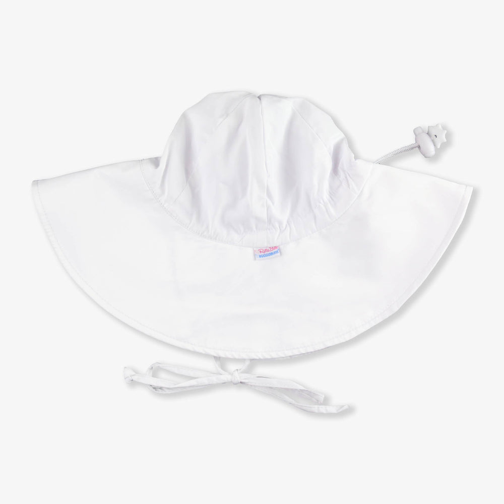Flat lay of white sun protective hat for babies and kids, showing classic shape and soft chin straps