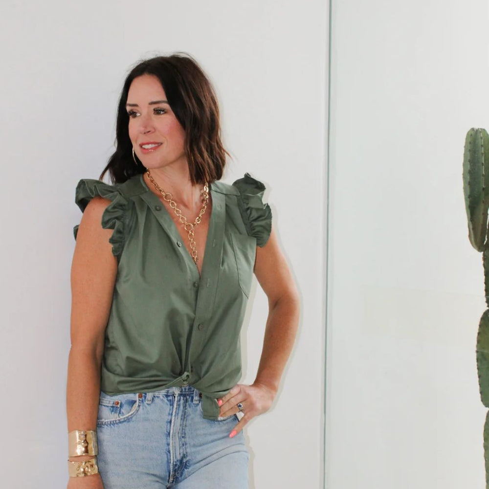 
                      
                        Close-up side view of the Olivia in Olive worn by designer Kate, highlighting sleeve detail and relaxed fit.
                      
                    