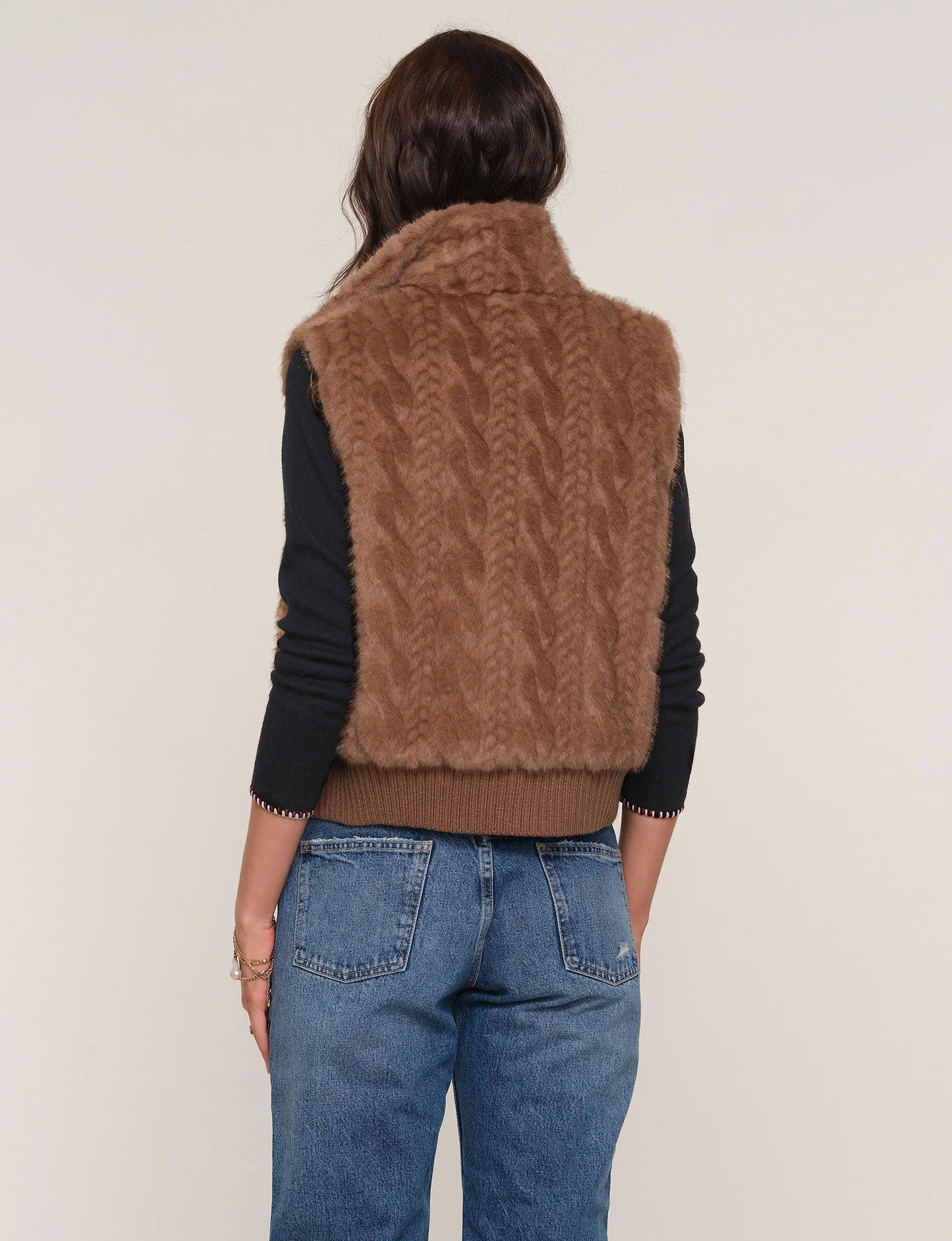Back view of The Liana Vest on model, showing full coverage, plush fabric, and classic silhouette.