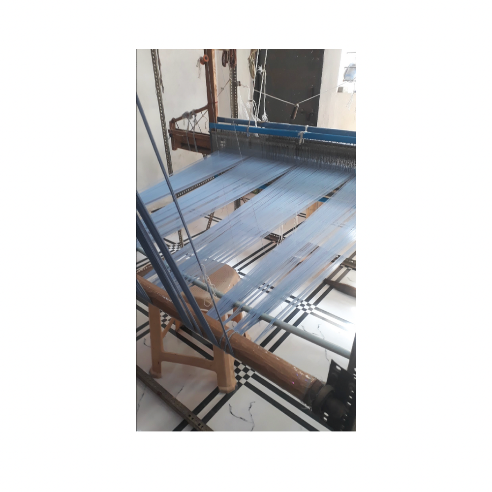 
                      
                        Traditional loom used by artisans to handweave the floral tooth fairy pillows, showcasing the craftsmanship behind each piece
                      
                    