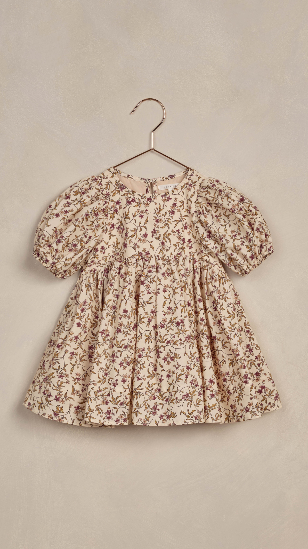 Flat lay of Luna Dress in fig floral, perfect for special occasions and family gatherings