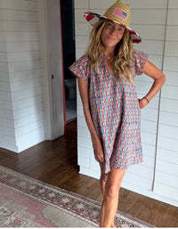 Marni Hand-blocked Dress by Perry Walker Collective featuring a colorful pattern, short sleeves, and a relaxed fit, worn
