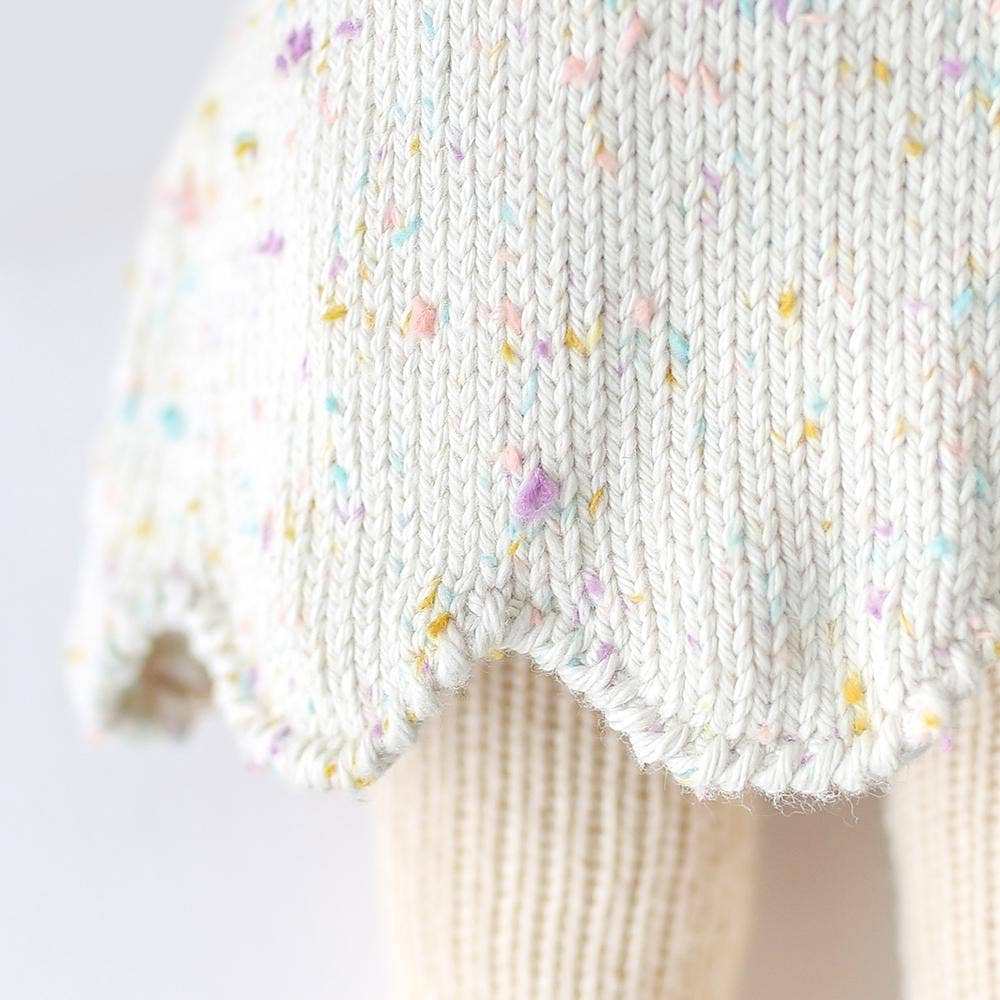 
                      
                        Close-up of the hem of Mia the Dog’s knit skirt showing stitch detail in 100% cotton yarn
                      
                    