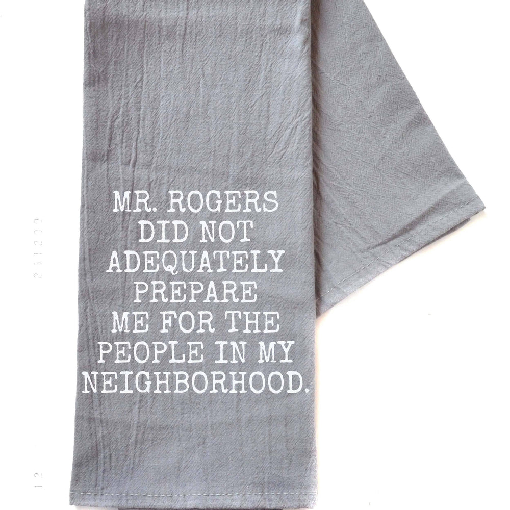 A humorous "Mr. Rogers Did Not Adequately Prepare Me For The People In My Neighborhood" tea towel, featuring bold, playful text. Made from high-quality cotton, this towel adds a touch of fun and personality to your kitchen. A perfect gift for fans of Mr. Rogers, or anyone who enjoys quirky, light-hearted home decor. The design is both practical and comical, perfect for drying dishes or hanging in your kitchen as a conversation starter. This towel combines style and humor, bringing a little laughter to every